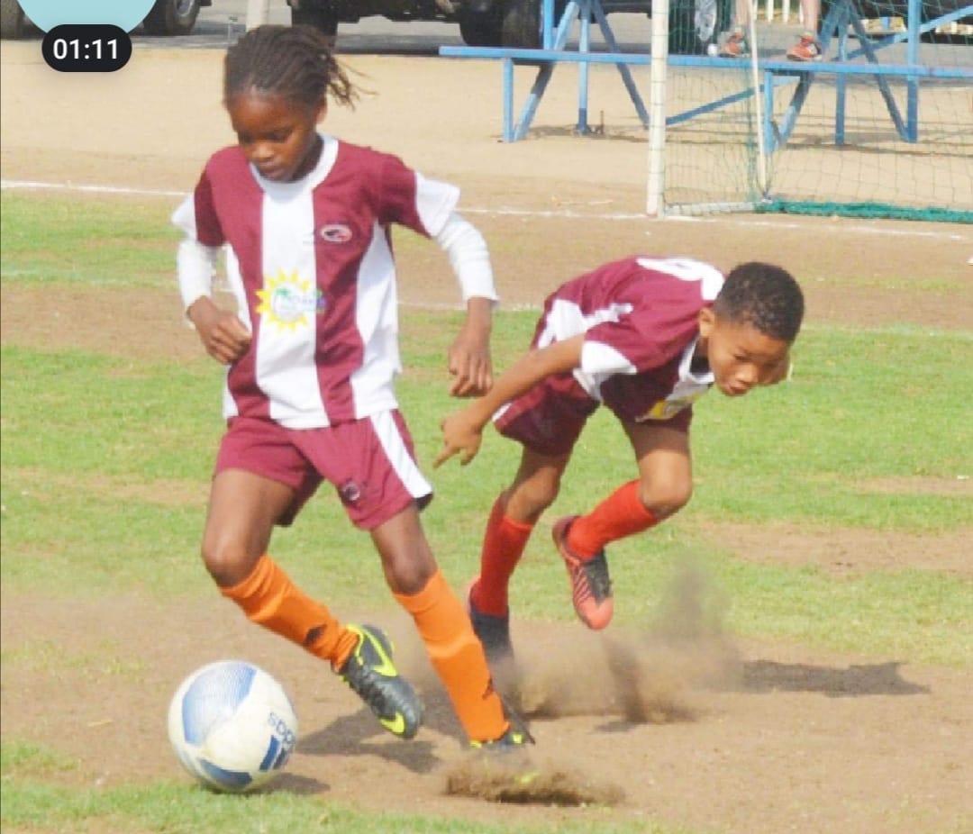 Two Swallows FC players challenge for the ball