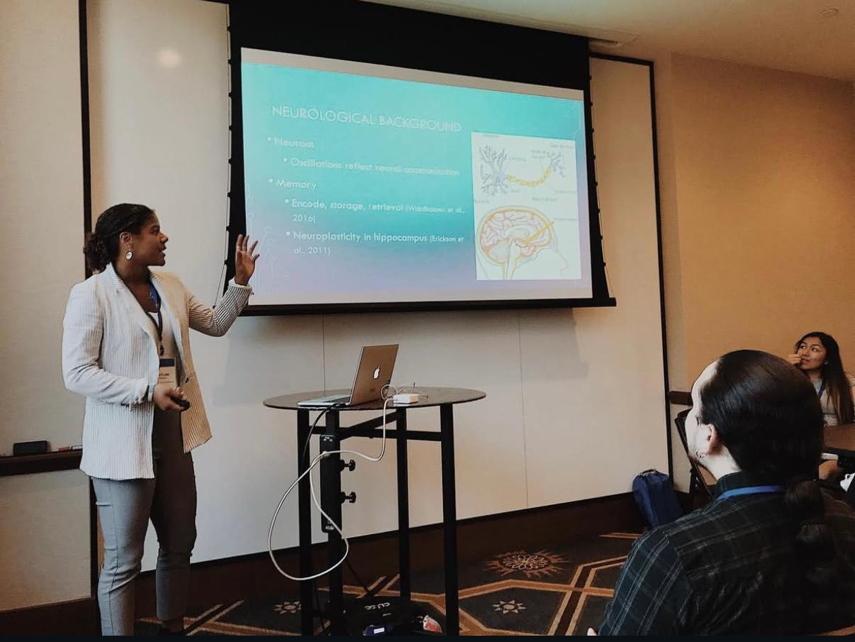 Dynamo Moscow forward Kaylan Williams in University presenting her studies to a group of professors and students at UCLA