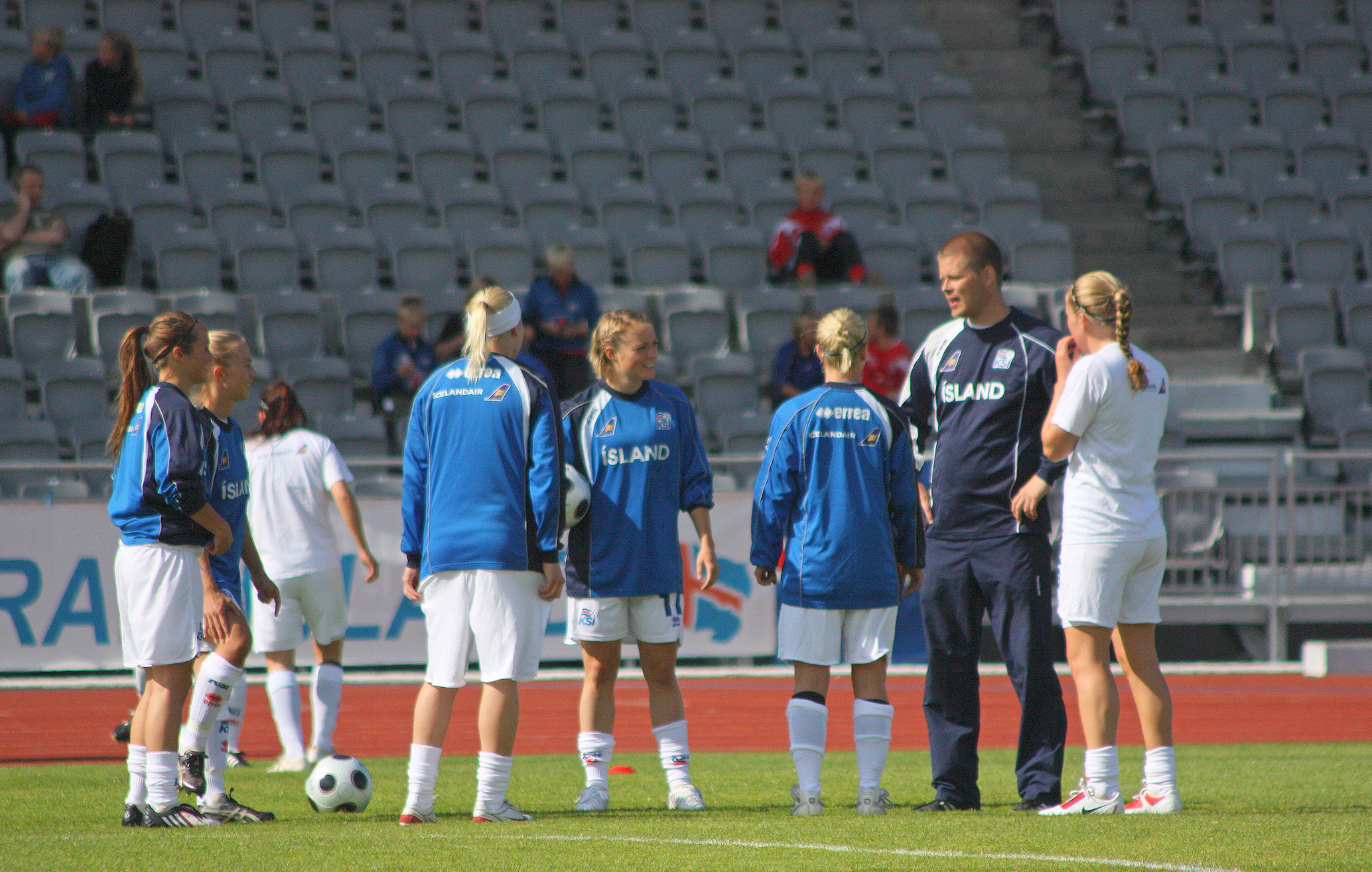 Iceland women's national team Coach Siggi Eyjolfsson with his players